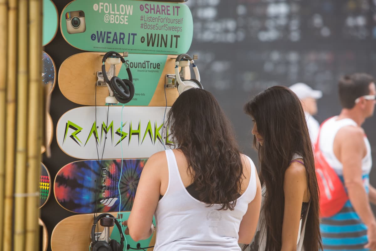 Headphones mounted on custom painted skateboard-deck displays